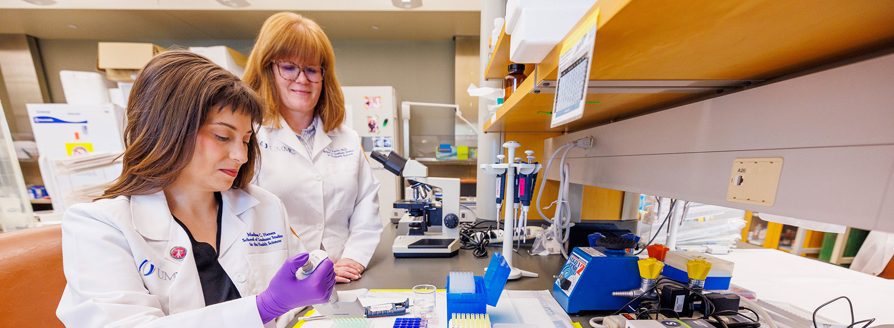 MD-PhD student Madison Hansen, left, conducts laboratory research alongside her mentor, Dr. Erin Taylor, assistant professor of physiology and biophysics.